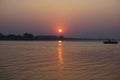 The red sun goes beyond the horizon. Vientiane, Laos. Mekong river