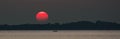 Red Sun at Sunset at Sea with Fishing Boat