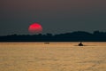 Red Sun at Sunset at Sea with Fishing Boat