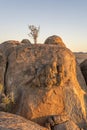 red sundown light on big Dolerite boulder in desert, near Hobas, Namibia