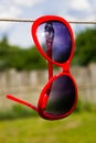 Red sunglasses on a rope