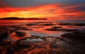 Red sunrise blankets Pearl Beach Australia Royalty Free Stock Photo