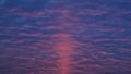 Red Sunrise through Blue Clouds