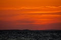 Red sunset across the sky above the sea Royalty Free Stock Photo