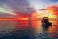 Boat watching sunset on the ocean