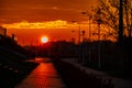 Red sunset in the city with a road and walking couple of people in love Royalty Free Stock Photo