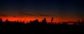 Red sunset and distant forest