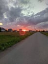 red sunset through garages and outbuildings in summer Royalty Free Stock Photo