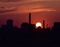 Red sunset over the city silhouette Royalty Free Stock Photo