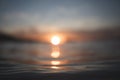 RED SUNSET AND REFLECTIONS ON THE SEA