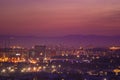 Red sunset sky over the city and mountains silhouette Royalty Free Stock Photo