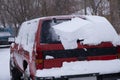 Red SUV was covered in snow after snowstorm on winter day Royalty Free Stock Photo