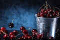 Red sweet cherries in a metal bucket on a dark and blue background. Summer taste. Fresh berries under the water drops. Royalty Free Stock Photo