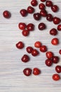 Red sweet cherry scattered on a white wooden table Royalty Free Stock Photo