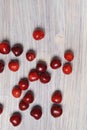 Red sweet cherry scattered on a white wooden table Royalty Free Stock Photo