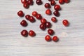Red sweet cherry scattered on a white wooden table Royalty Free Stock Photo