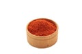 Red sweet paprika powder on plate on wooden bowl background Royalty Free Stock Photo