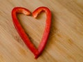 Red sweet pepper paprika in shape of heart with two pieces Royalty Free Stock Photo