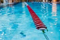 Red Swimming Lane Marker in swimming pool.Color-fast swimming pool lane line.Lane ropes in swimming pool.red plastic