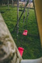 Red swings in the backyard, a playground for kids Royalty Free Stock Photo