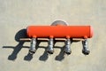 Red switchboard for fire hoses designed for connecting fire hoses. four taps and b couplings for bayonet quick connection. large a