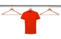 Red t-shirts on hangers isolated on white Royalty Free Stock Photo