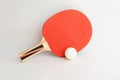 Red table tennis racket and ping pong ball on white Royalty Free Stock Photo