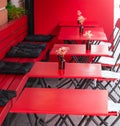 Red tables with chairs in a cafe Royalty Free Stock Photo