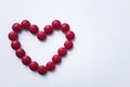 The red tablets are arranged in the shape of a heart. Red heart pills. The concept of a healthy heart. Royalty Free Stock Photo