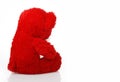 Red taddy bear turned away