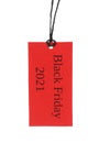 Red tag with words BLACK FRIDAY 2021 hanging on background Royalty Free Stock Photo