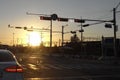 Red tail lamp and red traffic lights against sunset halo background Royalty Free Stock Photo