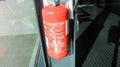 Red tank of fire extinguisher. Fire extinguishing system Royalty Free Stock Photo