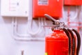 Red tank of fire extinguisher Overview of a powerful industrial fire extinguishing system Royalty Free Stock Photo