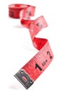Red tape meassure on rolled up on white Royalty Free Stock Photo