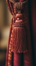 Red Tassel Detail on Maroon Curtain Royalty Free Stock Photo