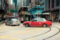 Red taxi and trams in Hong Kong busy streets, China Royalty Free Stock Photo