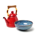 Red tea kettle and blue bowl Royalty Free Stock Photo