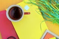 Red tea mug mockup, flat lay top view outdoor photo with bright red and yellow notebooks