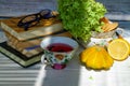 Red tea and reading glasses on the table in a cozy home. Royalty Free Stock Photo