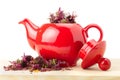 Red teapot with healing herbs