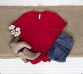 Red tee mockup - cold weather fall tshirt with cotton balls, boots & jeans Royalty Free Stock Photo