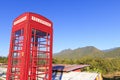 Red telephone booth or public payphone Royalty Free Stock Photo