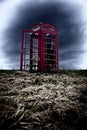 A red telephone box in the middle of nowhere Royalty Free Stock Photo