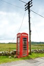 Red telephone box pole Scotland Royalty Free Stock Photo