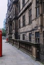 Red telephone box and post box in an urban street Royalty Free Stock Photo