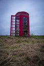 A red telephone box in the middle of nowhere Royalty Free Stock Photo