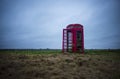 A red telephone box in the middle of nowhere Royalty Free Stock Photo