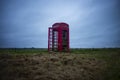 A red telephone box in the middle of nowhere Royalty Free Stock Photo