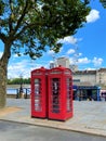 Red telephone boxes with London Eye in background Royalty Free Stock Photo